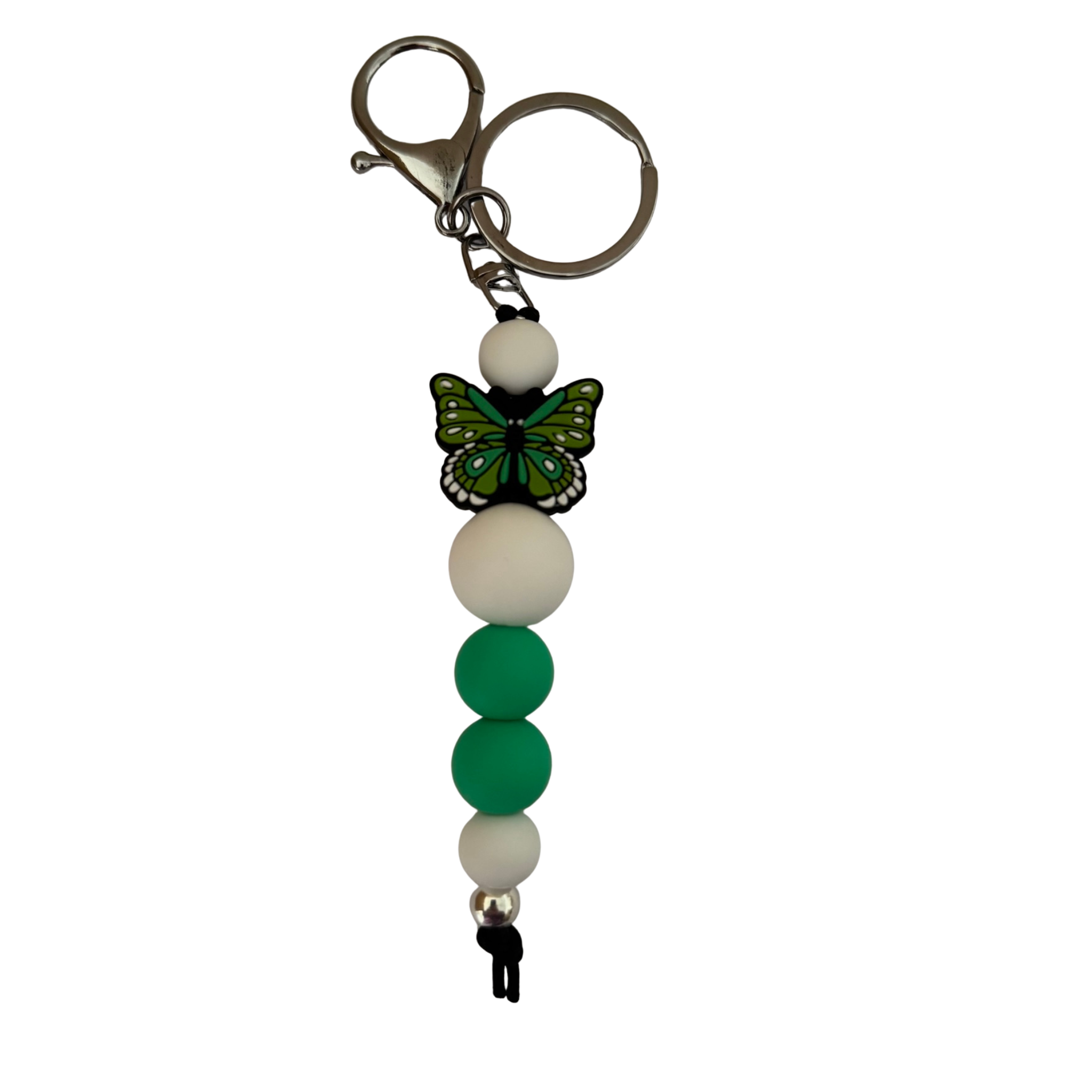 An 18cm keyring featuring a green butterfly silicone bead and white and green round silicone beads.