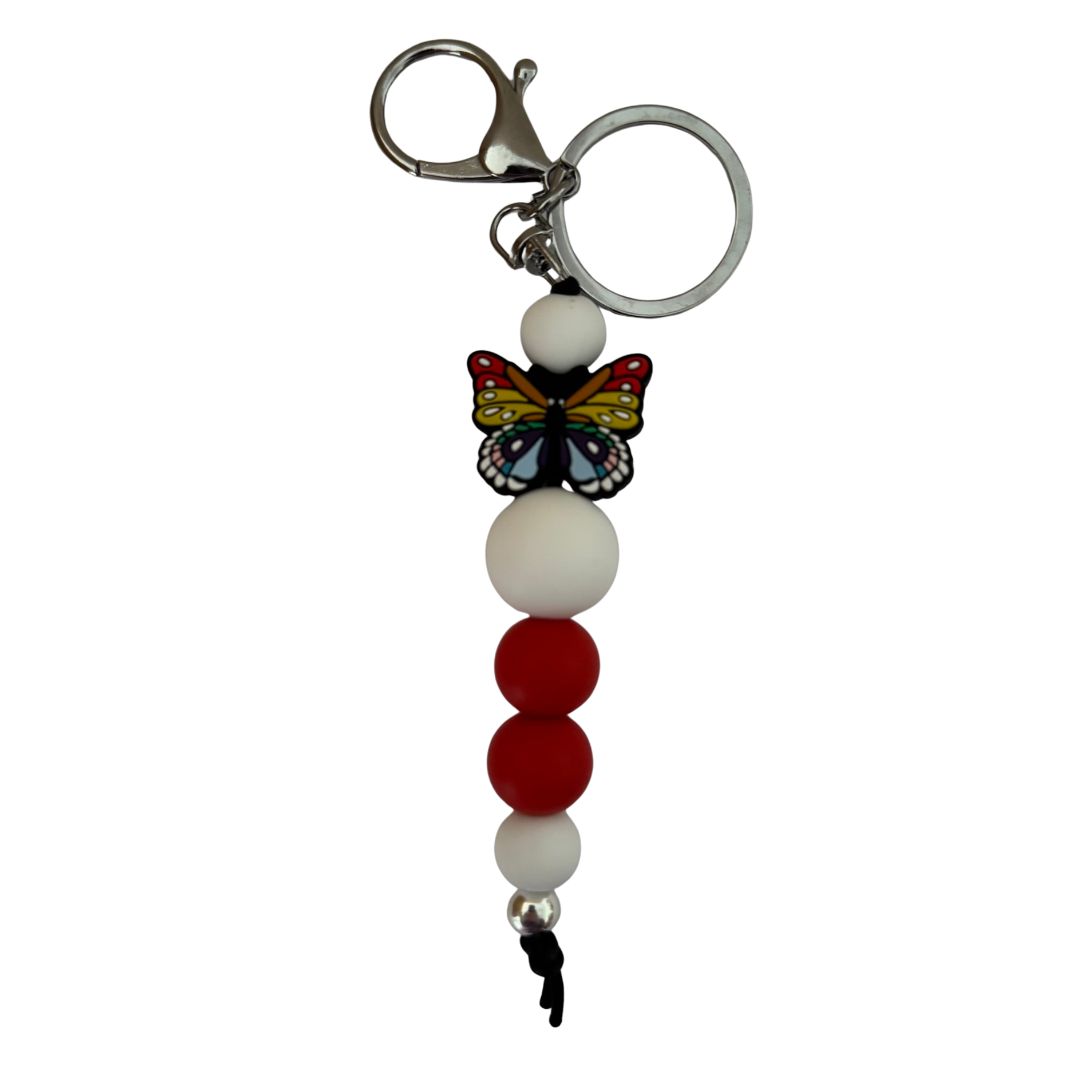 An 18cm keyring featuring a multi coloured butterfly silicone bead and white and red round silicone beads.