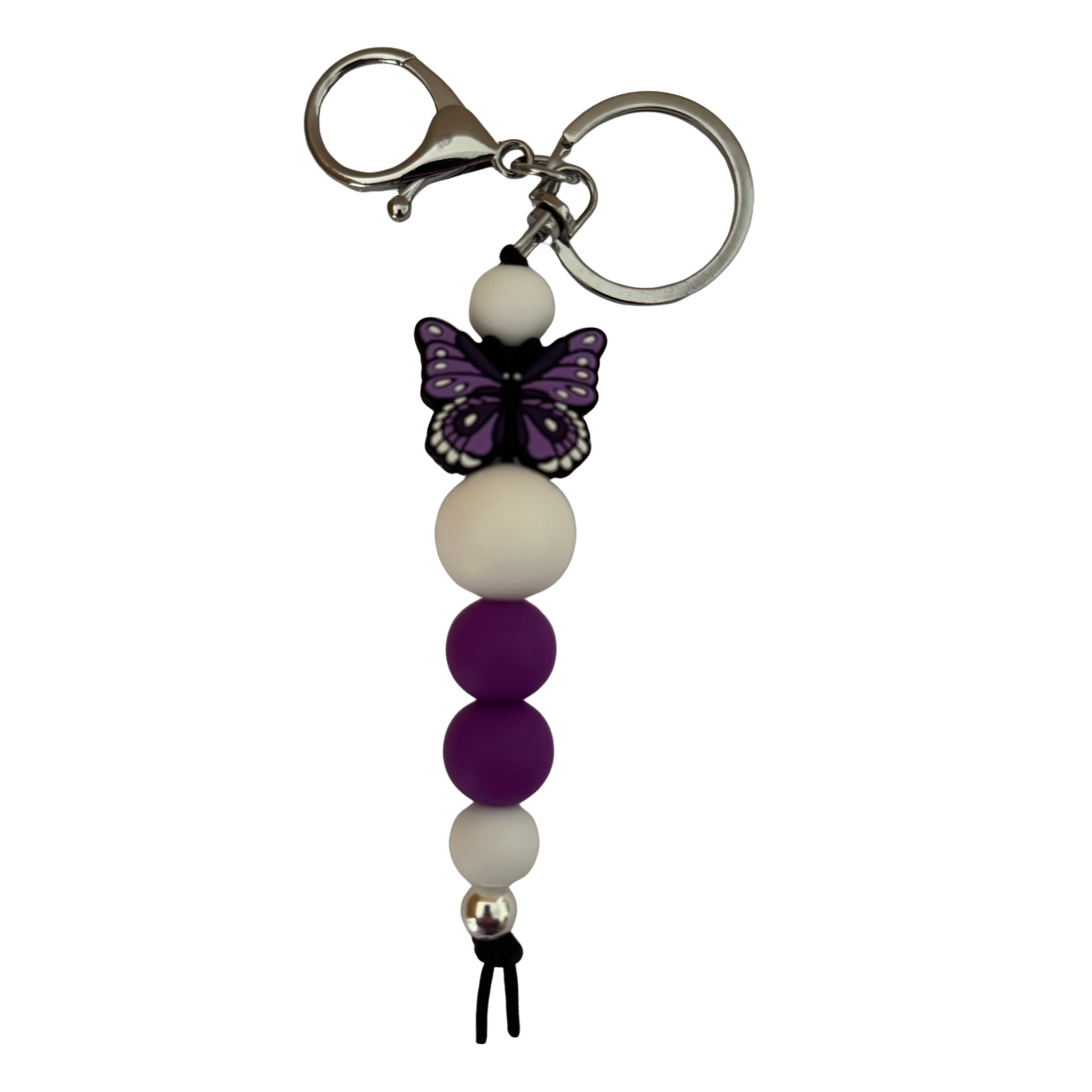 An 18cm keyring featuring a purple butterfly silicone bead and white and purple round silicone beads.