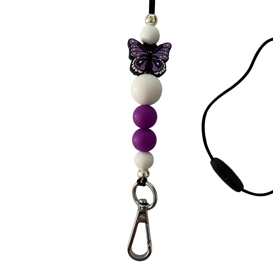Lanyard with safety breakaway clasp featuring purple and white silicone beads, a 10mm silver aluminium bead, and a purple butterfly charm on a durable cord.