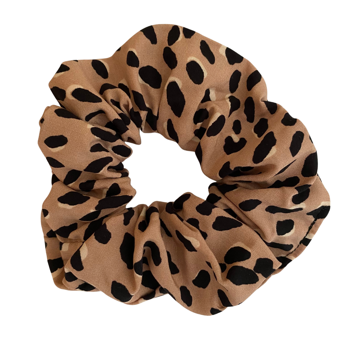 Cheetah Animal Spot Rayon Scrunchie is handmade from soft and breathable 100% viscose fabric, offering a lightweight and comfortable feel that’s perfect for everyday wear.