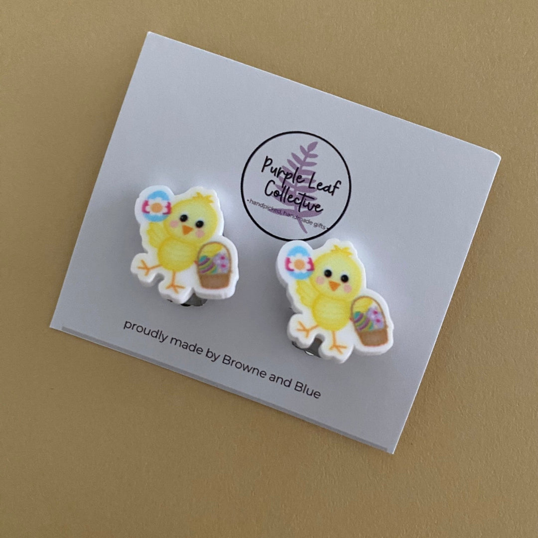 Clip on Earrings featuring yellow chicken holding a Easter Egg and basket of Easter Eggs