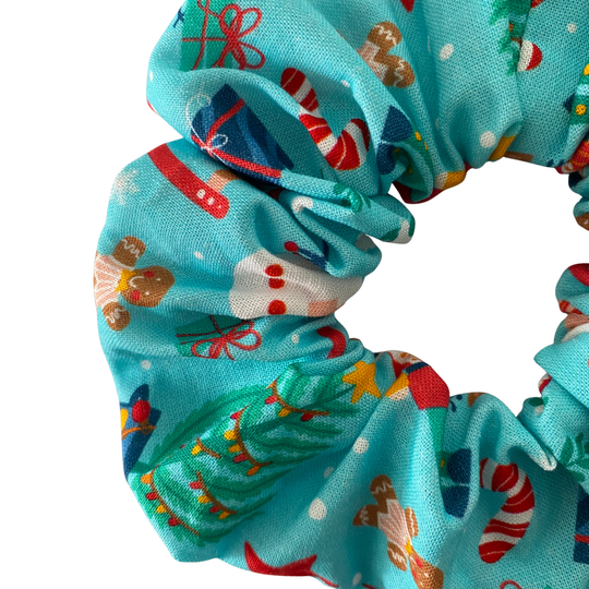 Aqua blue scrunchie featuring festive Christmas images.