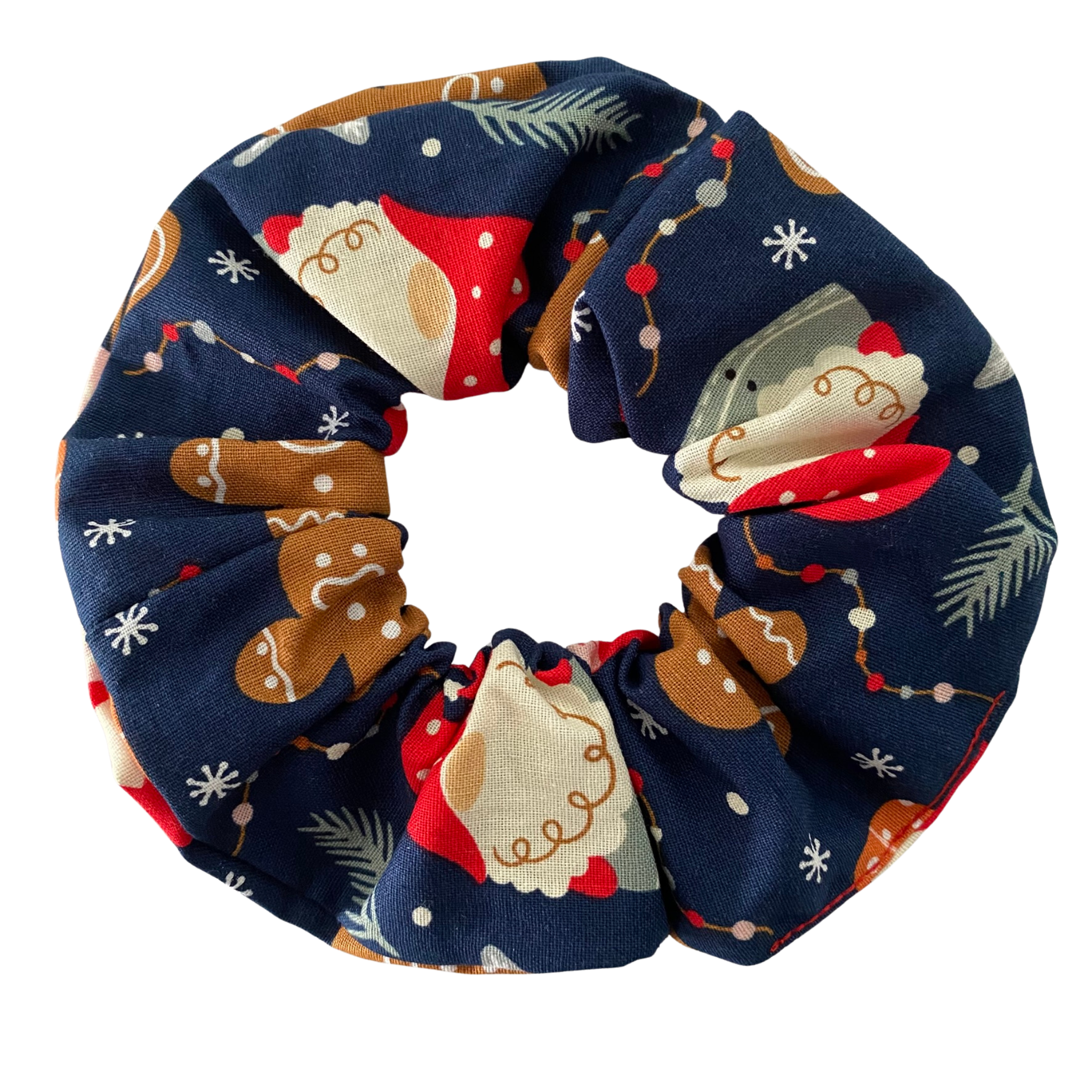 A dark blue scrunchie featuring festive images of gnomes and gingerbread man.