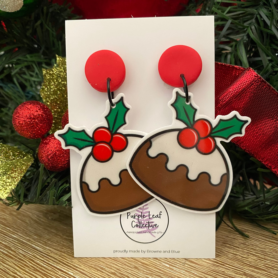Christmas pudding dangle earrings with red stud topper on a white card.