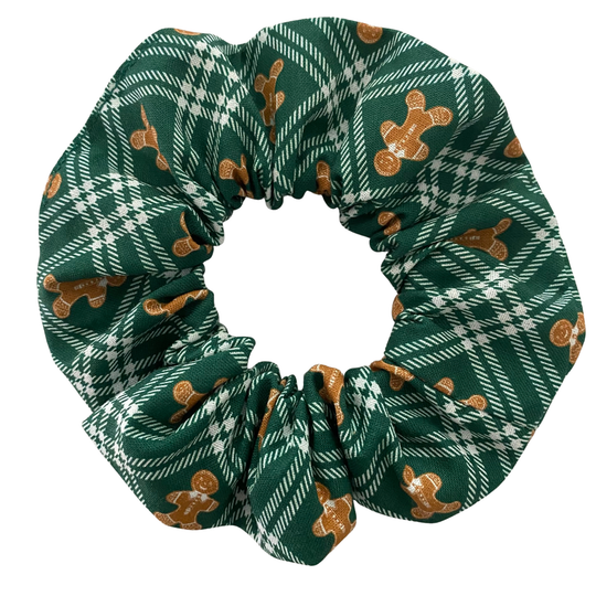 Green plaid scrunchie with gingerbread men pattern on a white background.