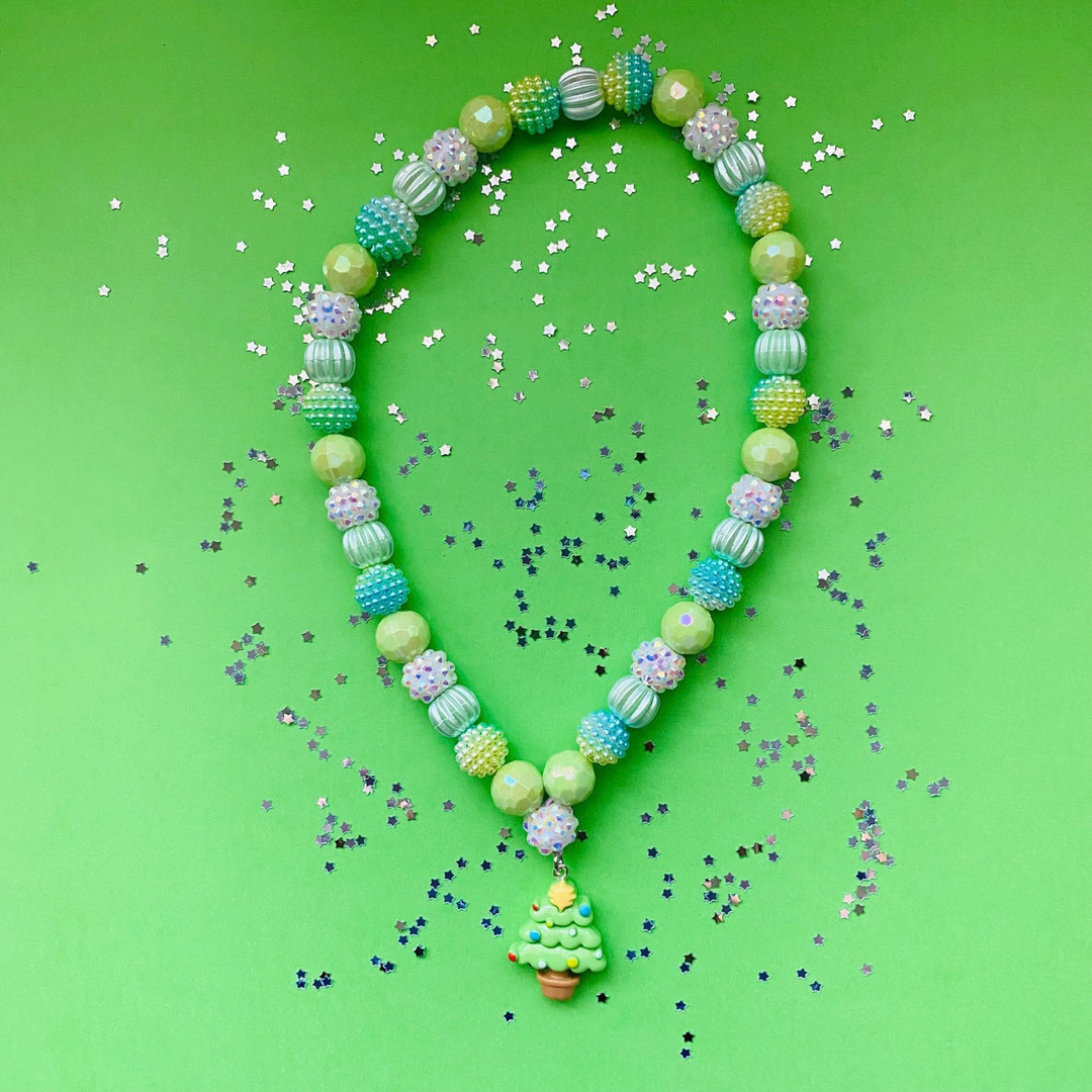 A beaded necklace with a Christmas tree charm, featuring light green, blue and iridescent beads.
