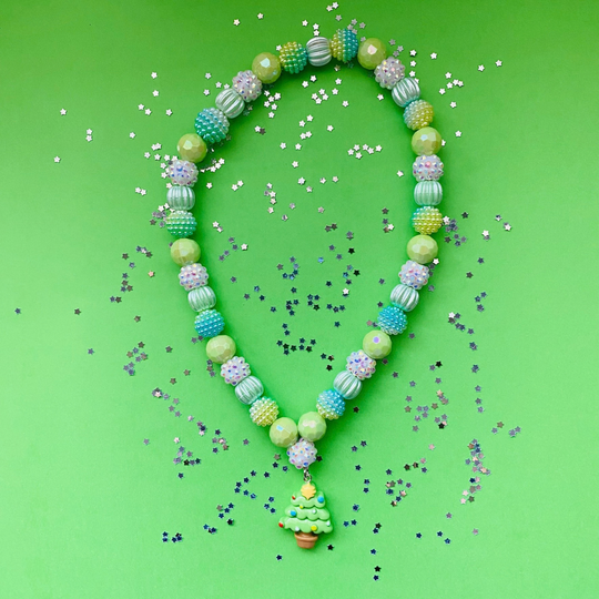 A beaded necklace with a Christmas tree charm, featuring light green, blue and iridescent beads.
