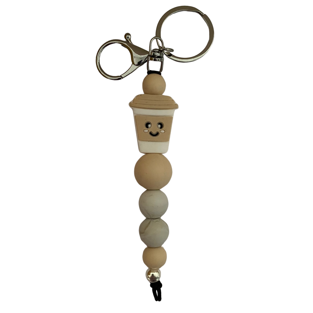 A 18cm keyring with a cream coffee cup silicone bead and matching round silicone beads.