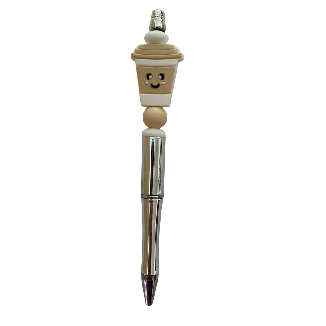 Pen with a coffee cup cream on top on a white background.