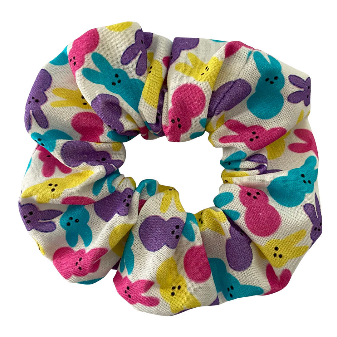 Colourful scrunchie with bunny pattern on a white background.