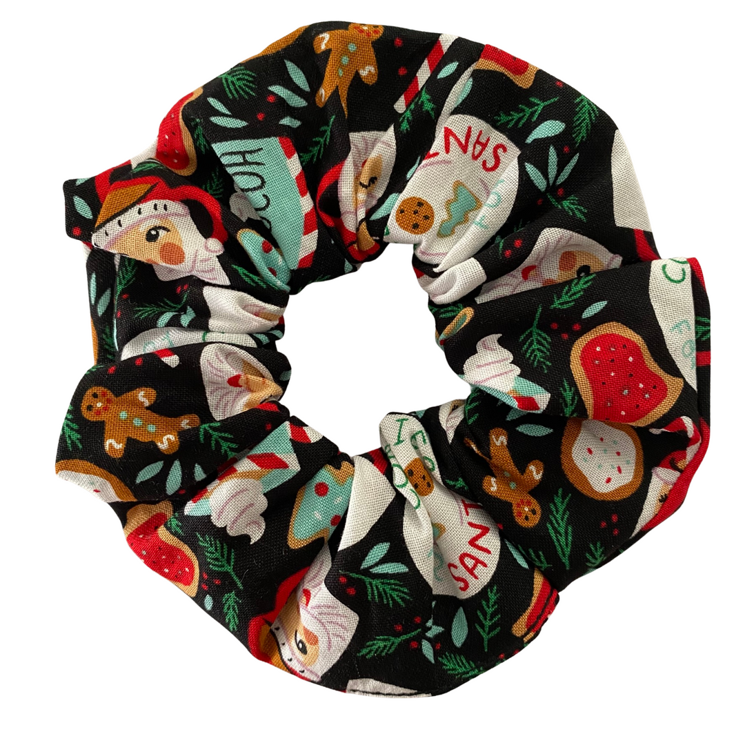Cookies for Santa Christmas Scrunchie with cookies, candy canes and holly print on a black fabric. 