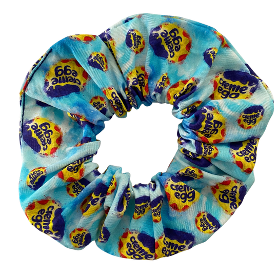 Blue Scrunchie with Cadbury Creme Egg pattern on a white background.