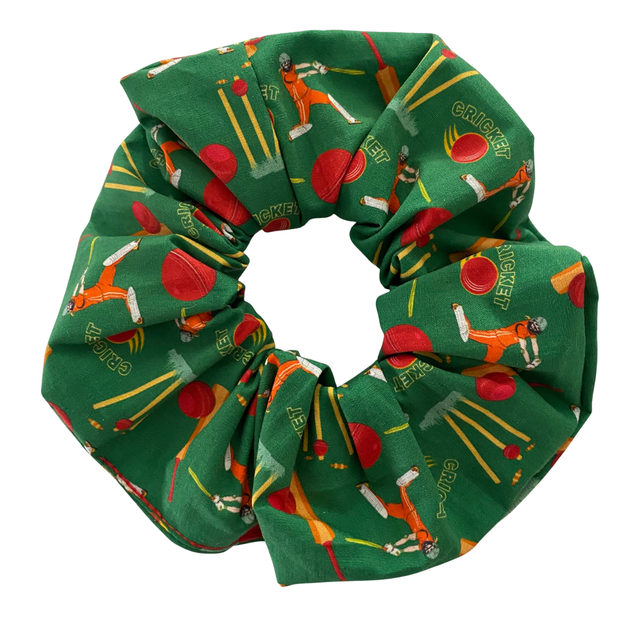 Green scrunchie with cricket-themed design featuring a pattern of female cricket players, bats, balls and stumps.