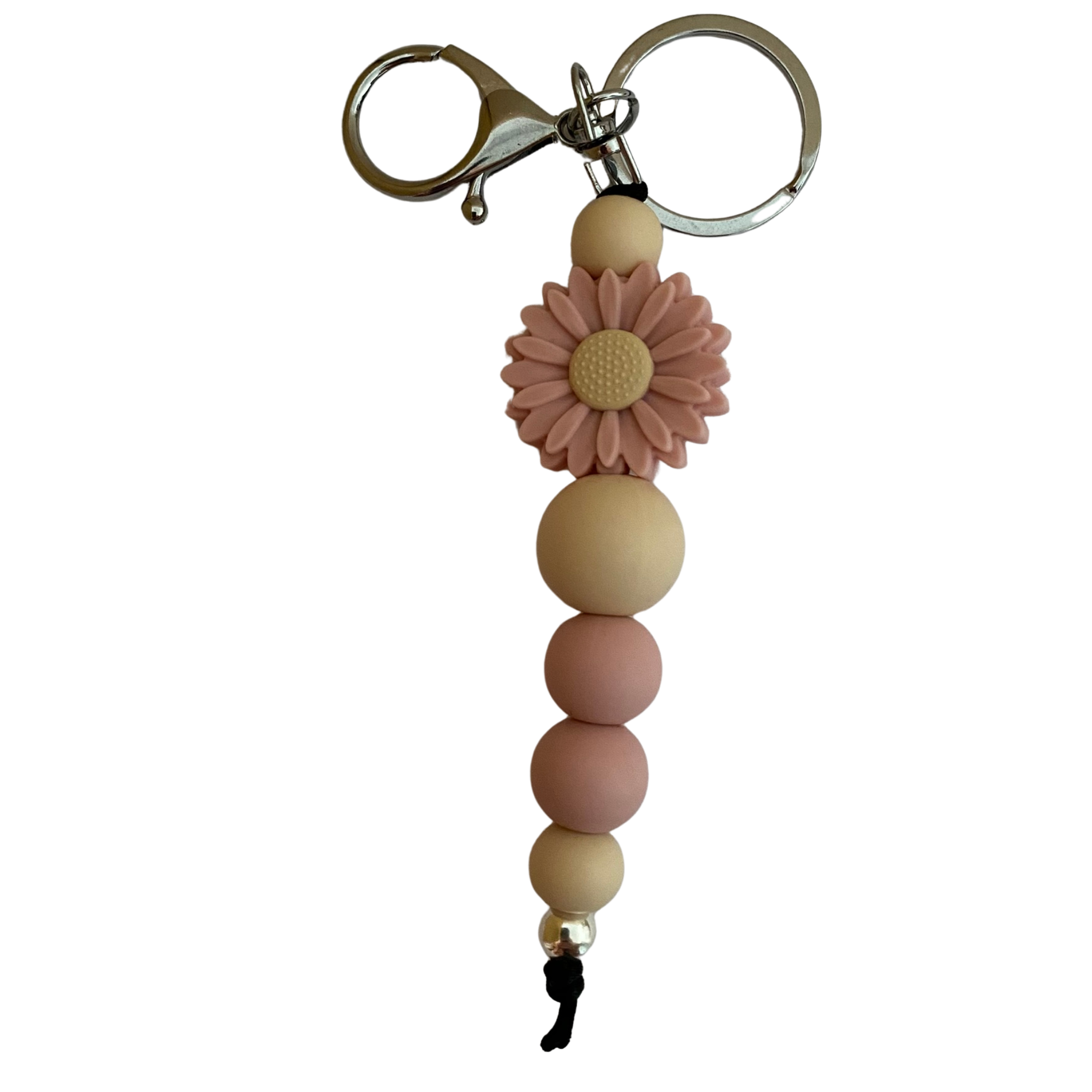 A keyring with a dusky rose daisy silicone bead and other assorted beads.