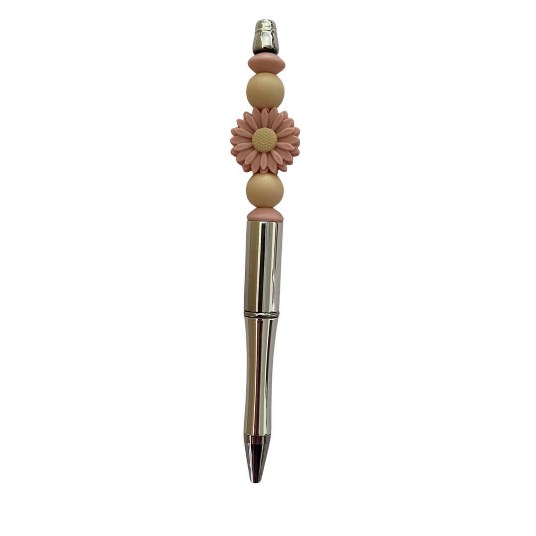 Decorative pen with dusky rose floral design on a white background.