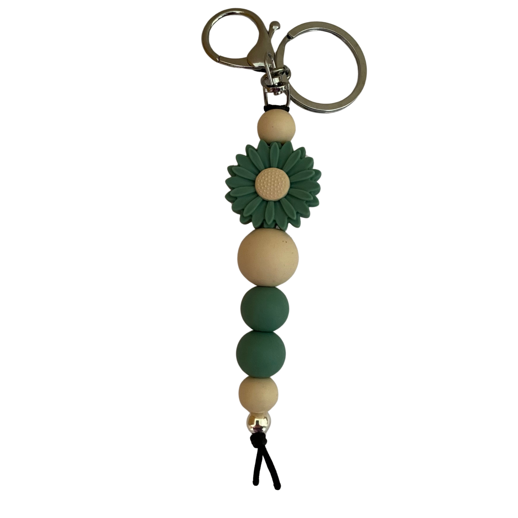 An 18cm keyring featuring a Feldspar Green coloured daisy silicone bead and other round coloured silicone beads.