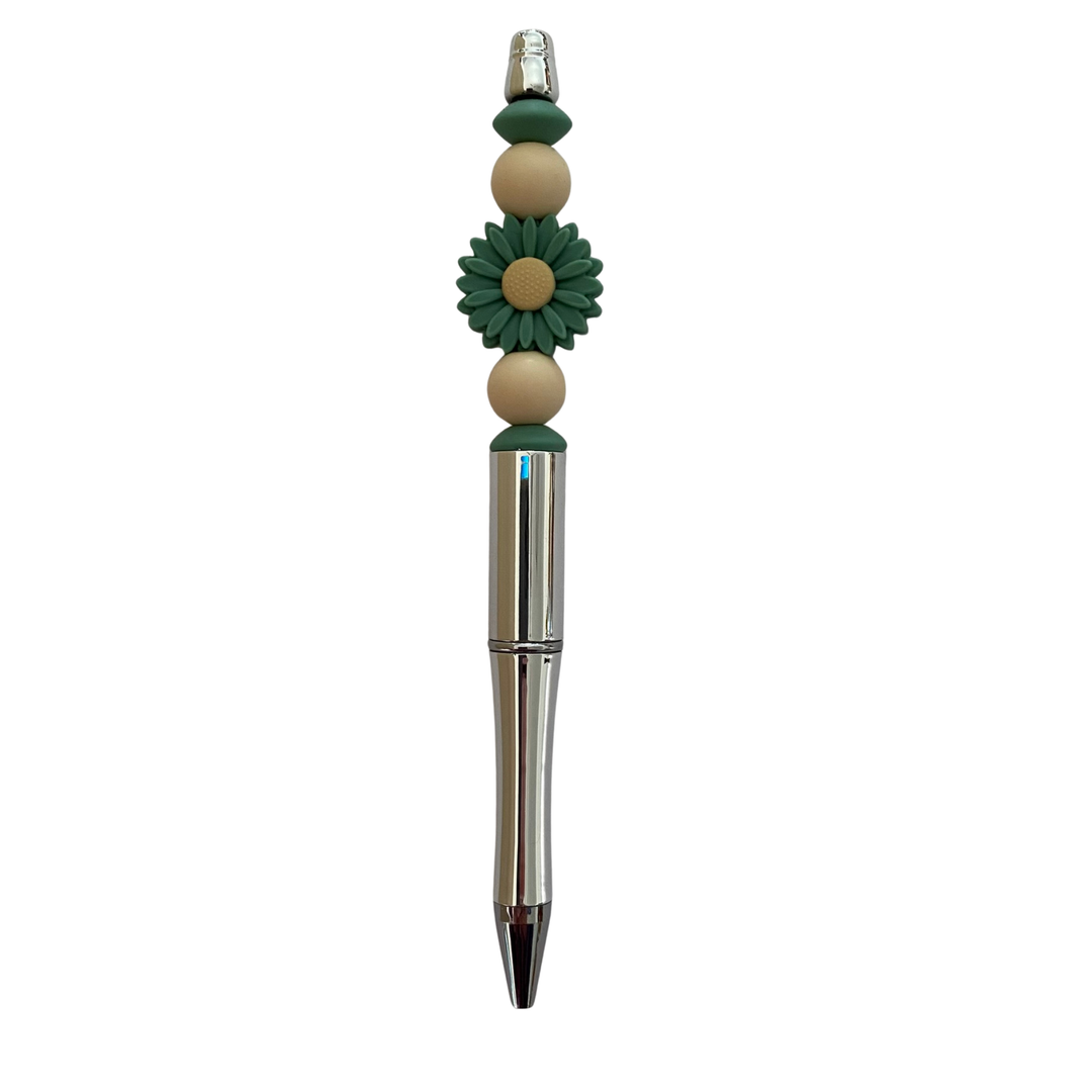 Pen with decorative Daisy Feldspar Green beads on a white background.
