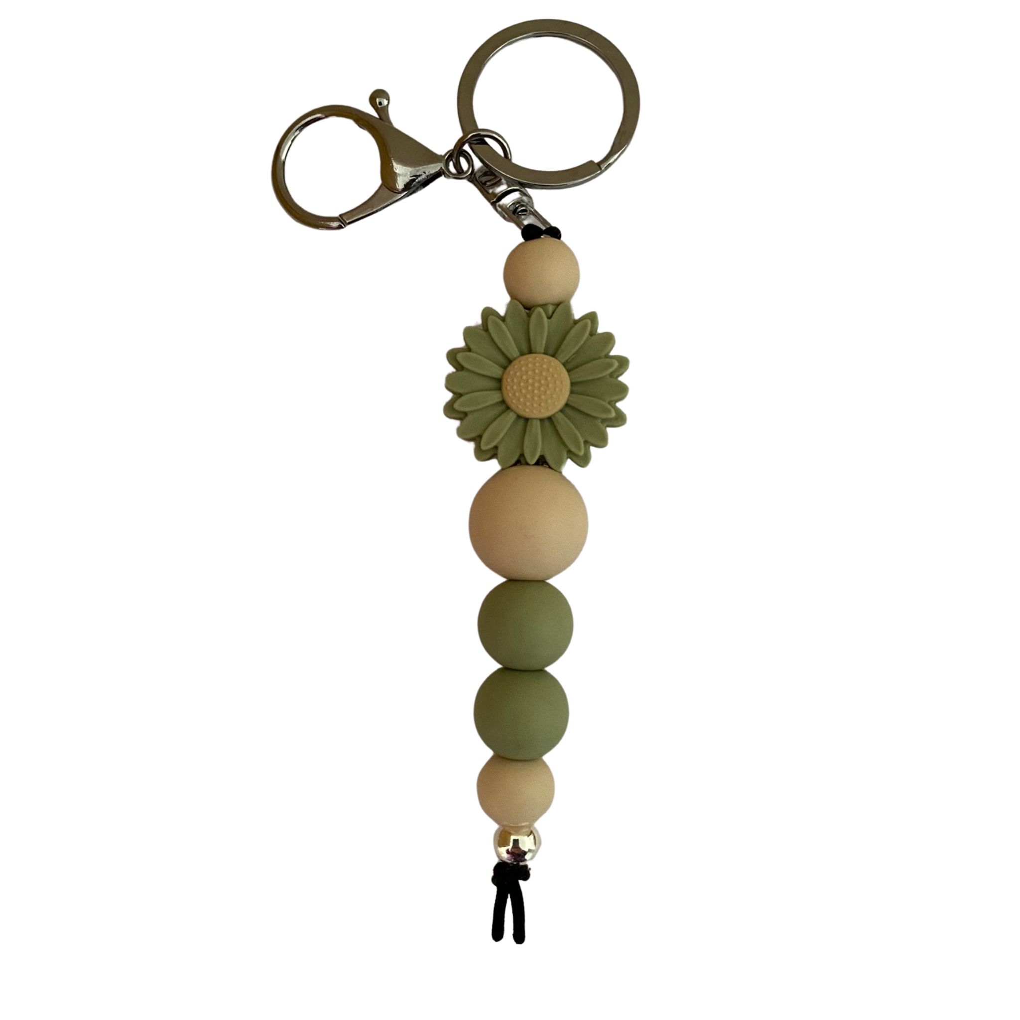 An 18cm keyring featuring a green lint coloured daisy silicone bead and other round coloured silicone beads.