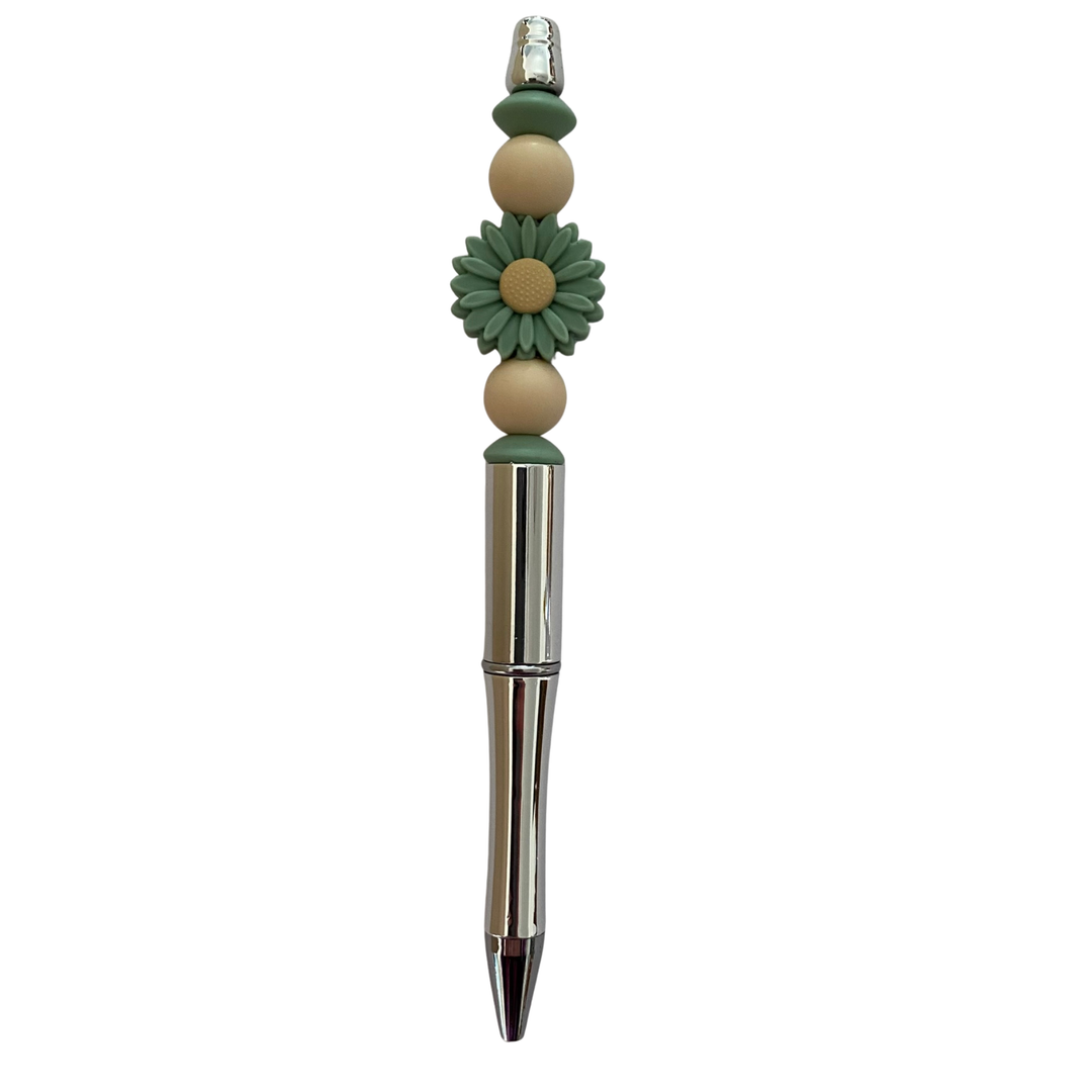 Decorative pen with a Daisy Sage Green  bead on a white background.