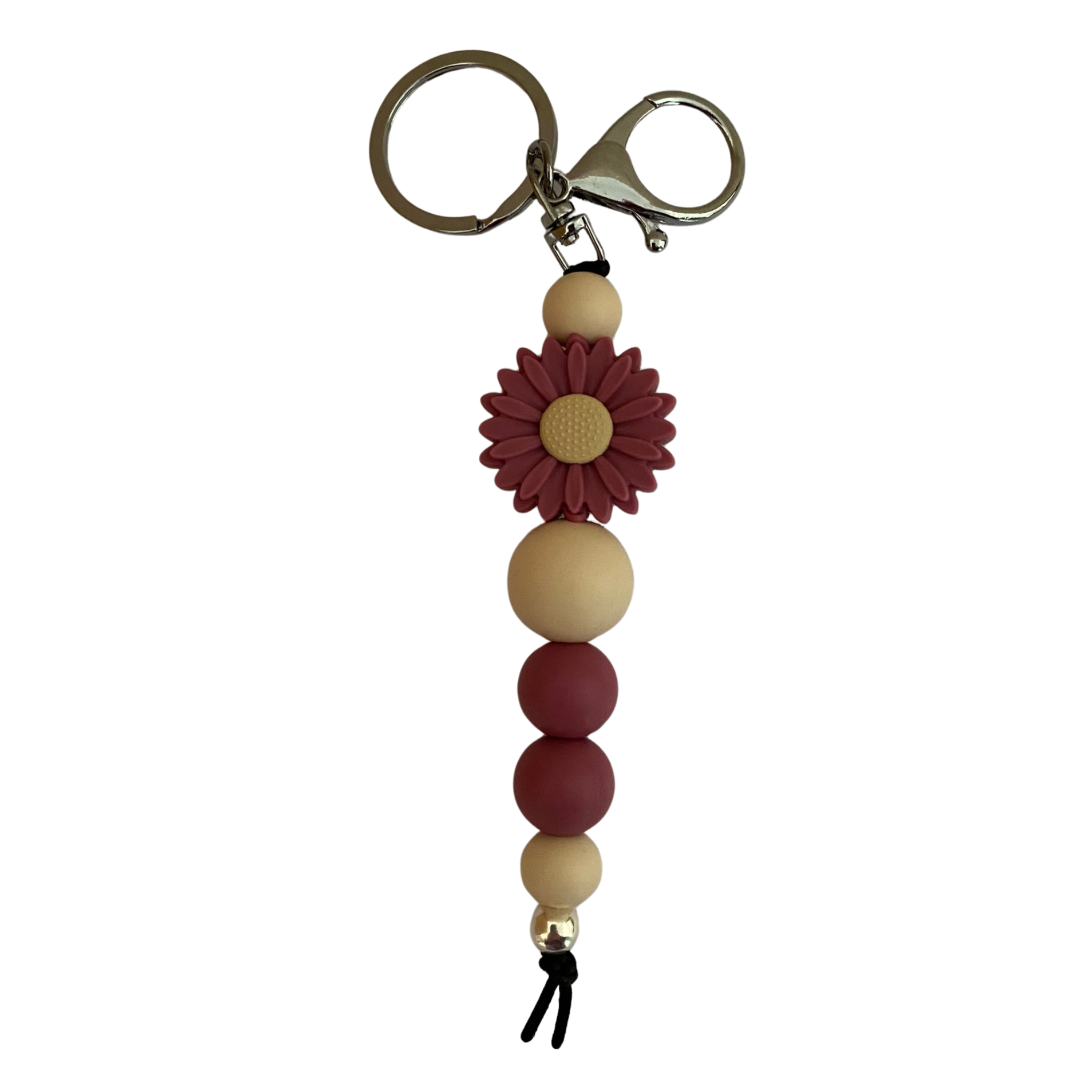 An 18cm keyring featuring a violet coloured daisy silicone bead and other round coloured silicone beads.
