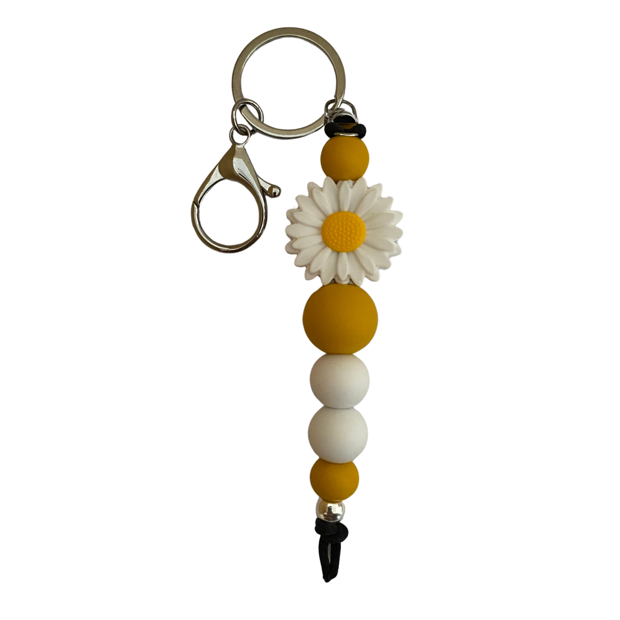 A keyring with a white daisy silicone bead and other round silicone beads.