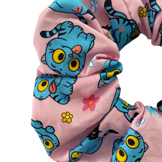A close up of Derpy Tiger K-Pop Demon Hunters on a pink Scrunchie.
