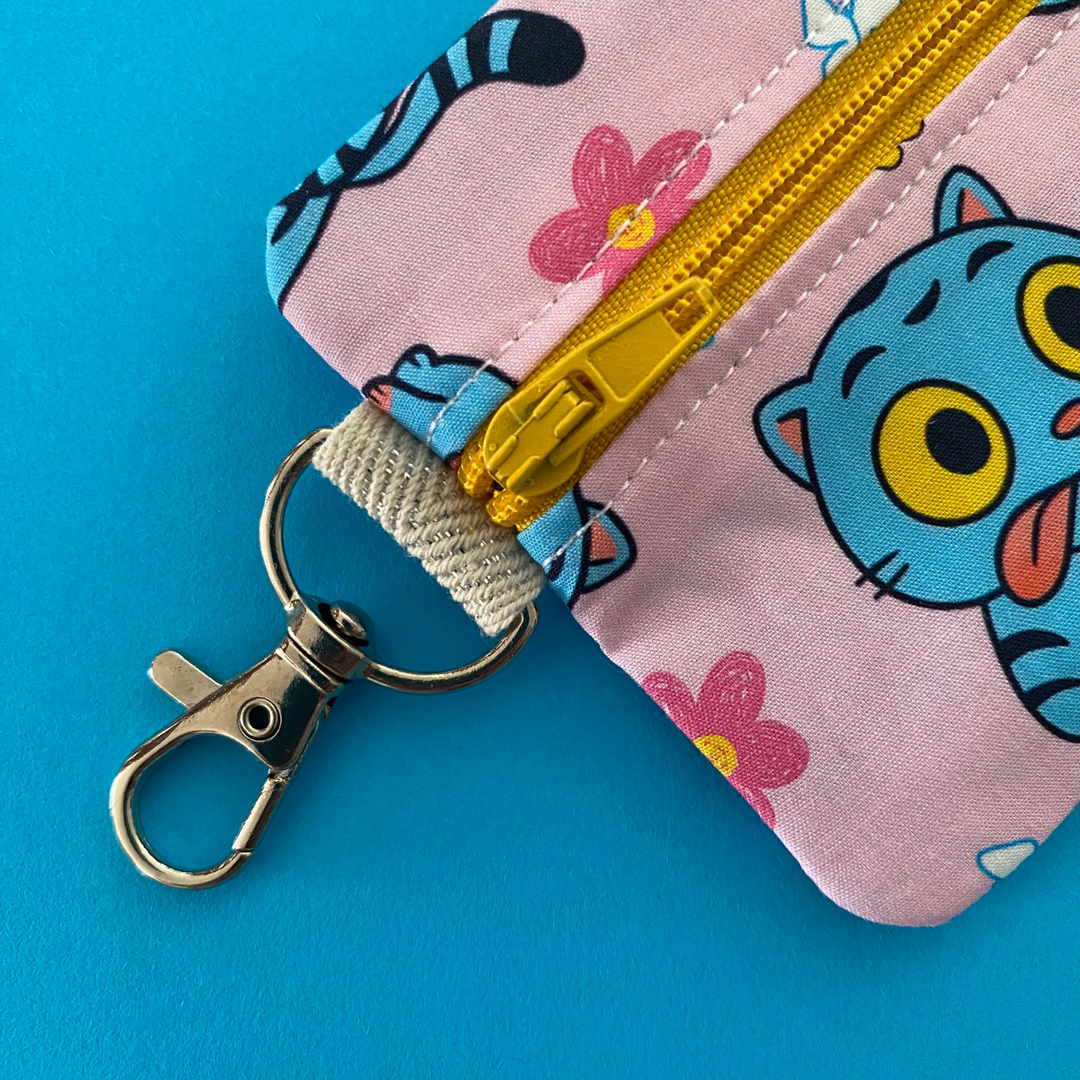 Clasp view of Derpy Tiger from K-Pop Demon Hunters featured on a light pink coin purse with clasp.