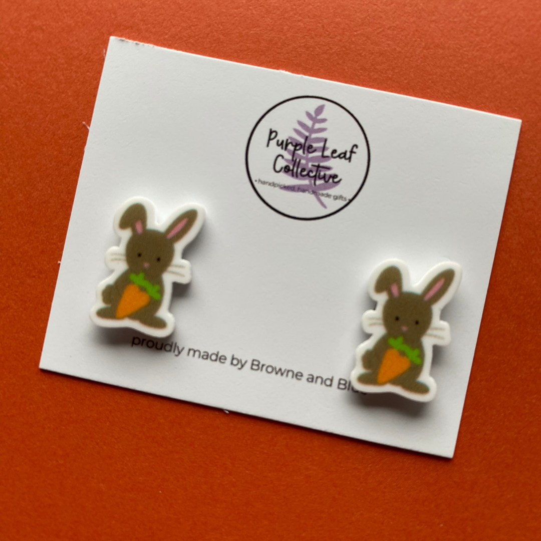 Approx 15mm stud earrings featuring Easter Chocolate Rabbit holding a carrot and made with Hypoallergic Surgical Steel Posts.