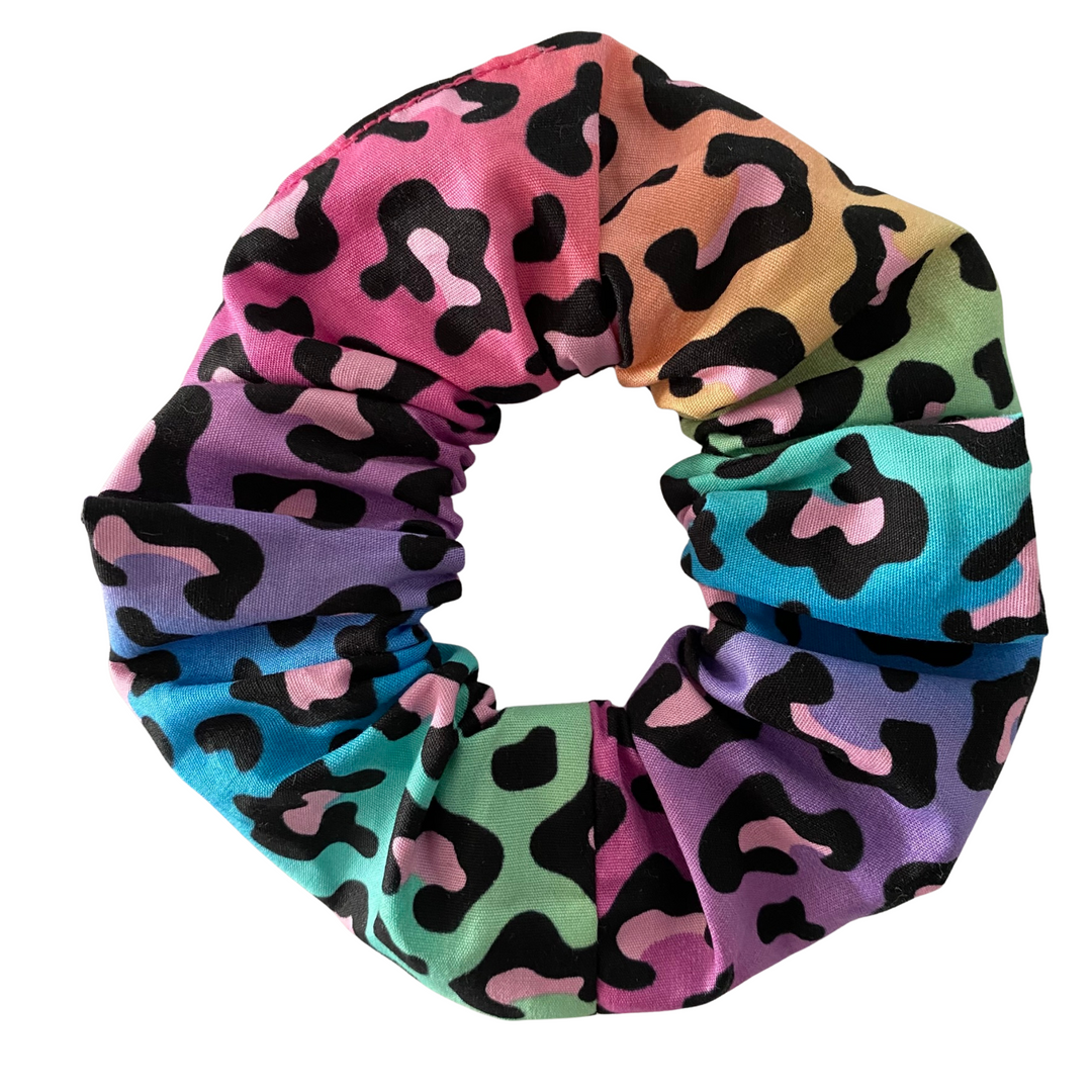 Multicolored scrunchie with a leopard pattern on a white background.