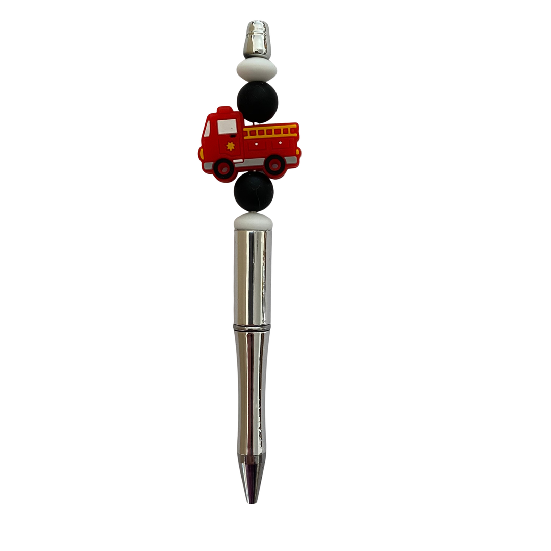 Pen with a red fire engine design on a white background.