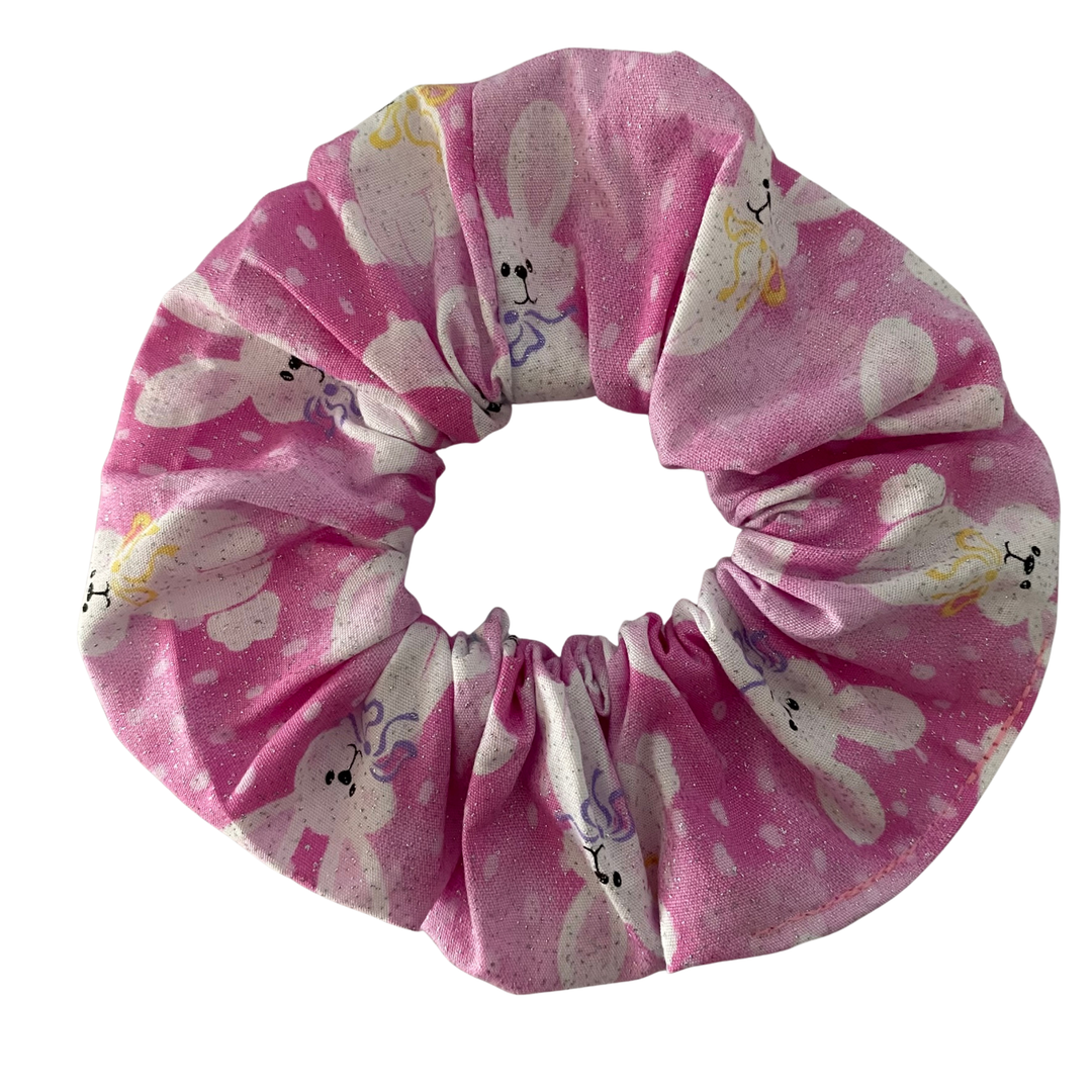 Pink scrunchie with bunny pattern on a white background
