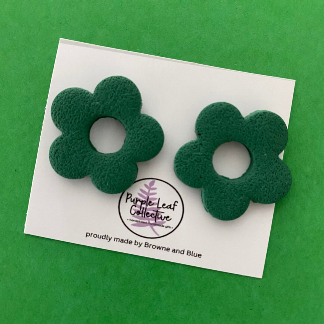 Drop stud earrings with five forest green polymer clay flower petals, set on surgical steel posts for comfort and durability.