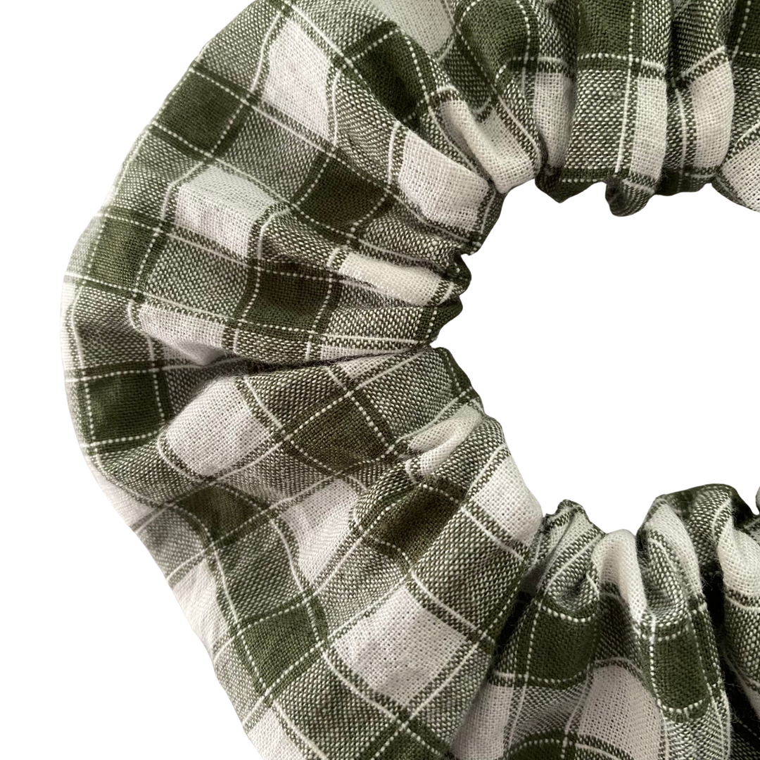 Close up view of forest green checkered scrunchie.