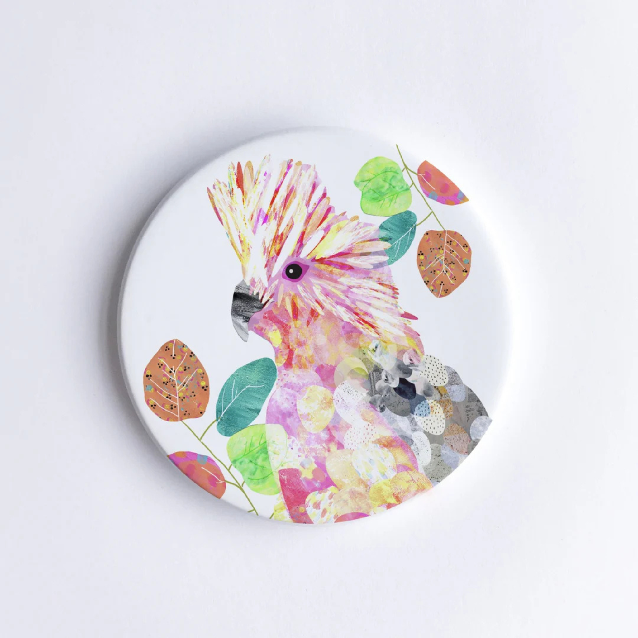 A 90mm diameter ceramic drink coaster featuring a picture of a Galah.
