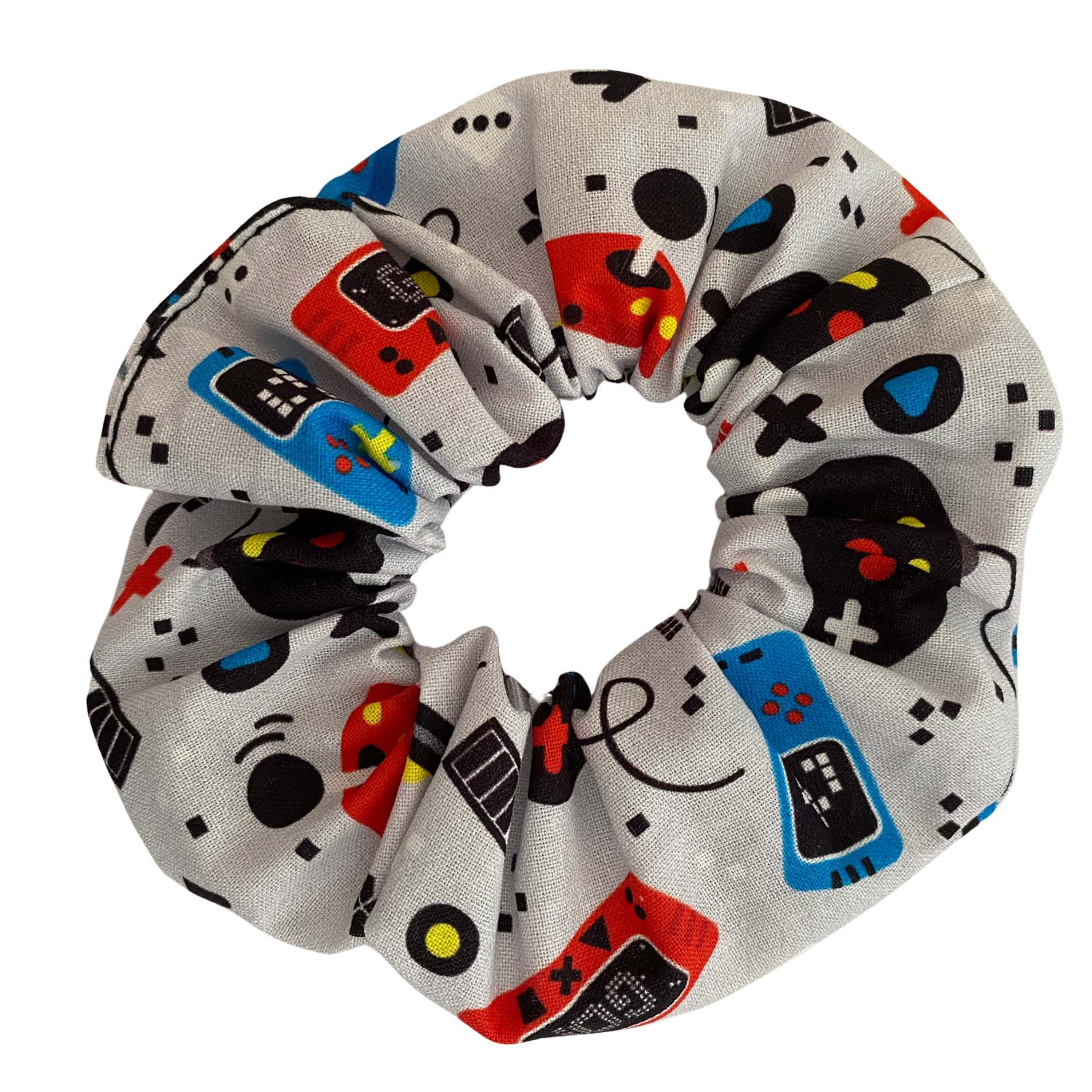 Our Gaming Scrunchie featuring fun, nostalgic prints of gaming consoles, headphones, and retro handheld devices on a light grey fabric.