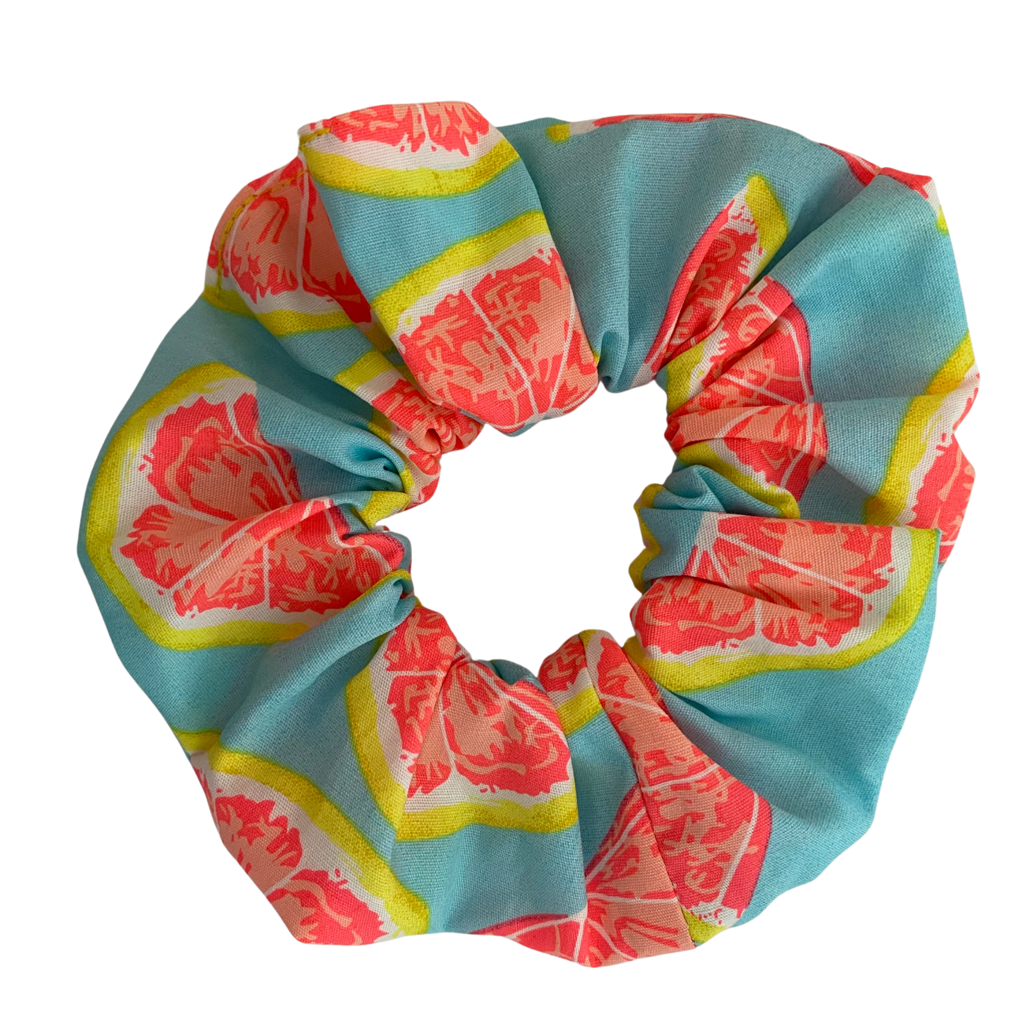 Get Sliced Scrunchie features juicy grapefruit-inspired prints and featuring durable braided elastic for secure styling.