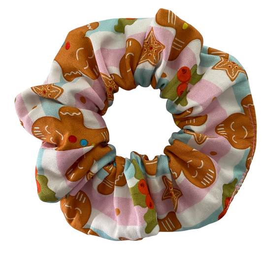 Scrunchie with gingerbread man pattern on a white background.