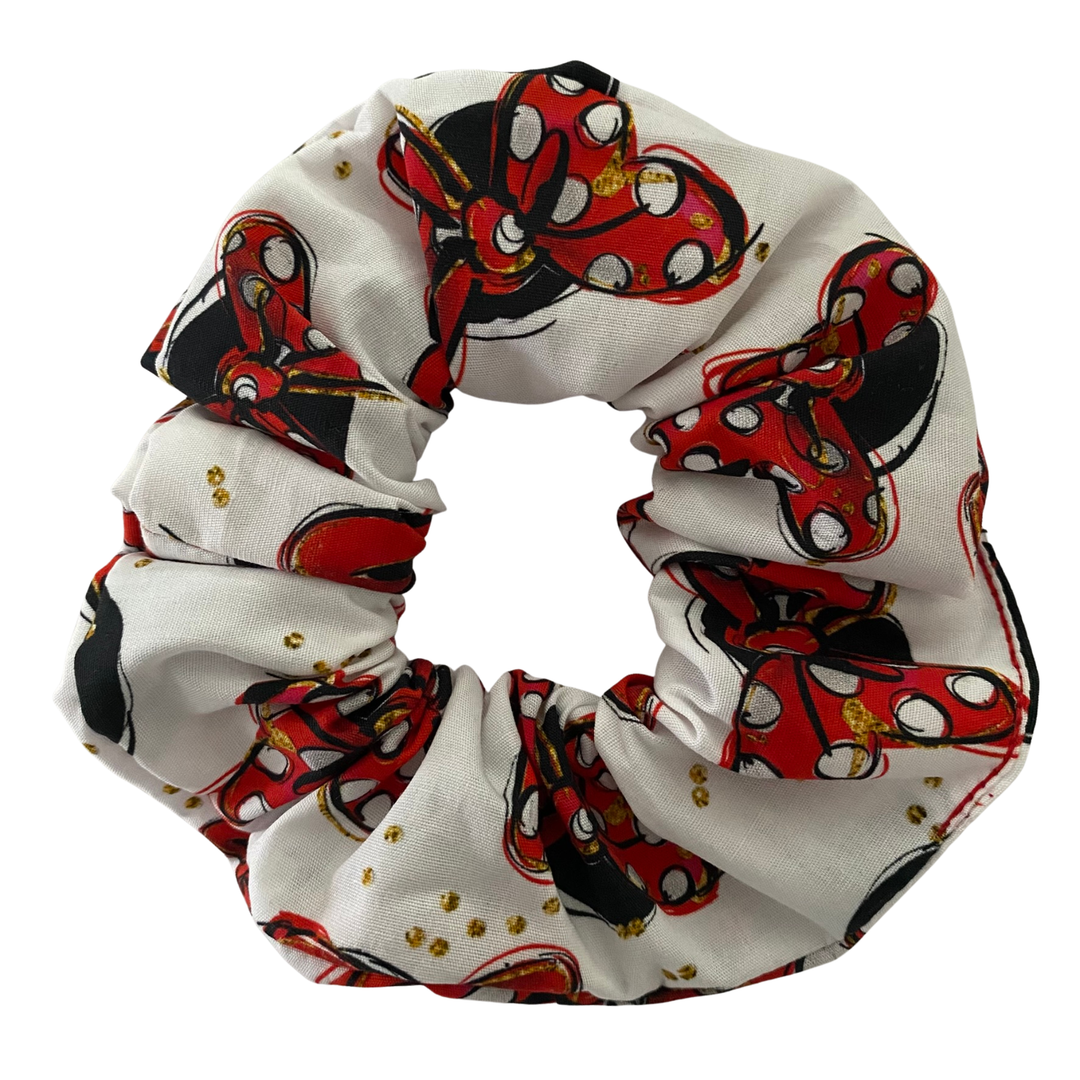 Handmade white cotton poplin scrunchie featuring a pattern of red bows and girl mouse silhouettes.