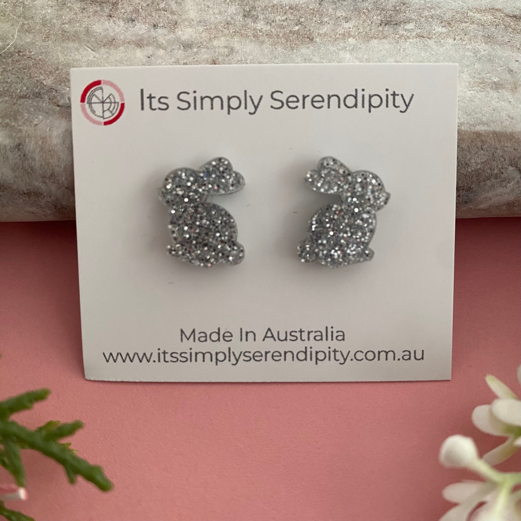 Silver glittery bunny-shaped earrings.