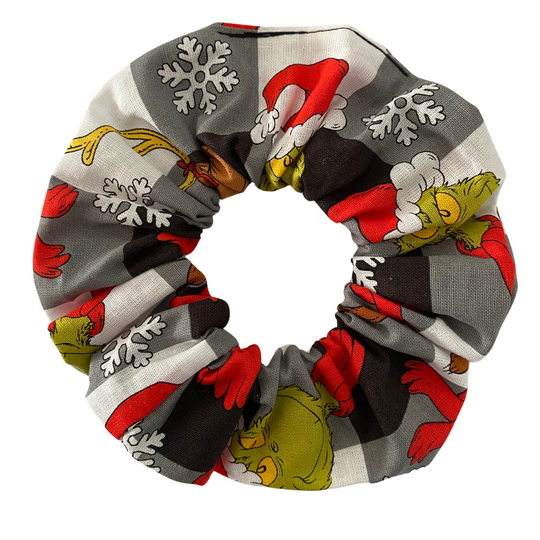 Scrunchie with the Grinch character on a black check fabric.
