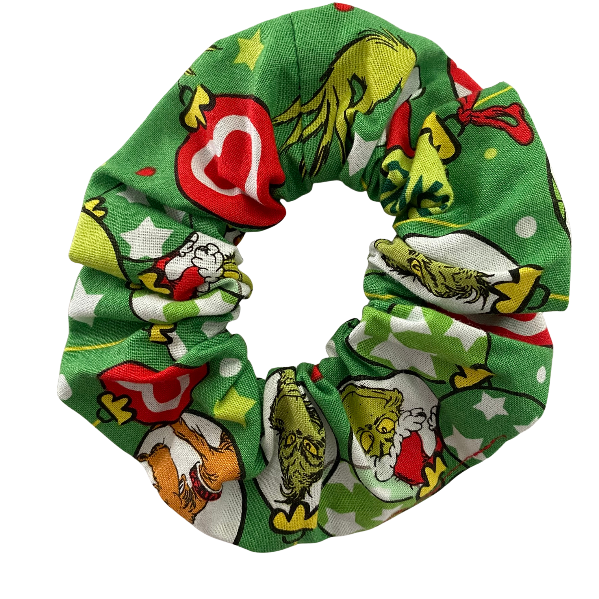 Handmade Grinchmas Scrunchie with playful Grinch images on a green fabric.
