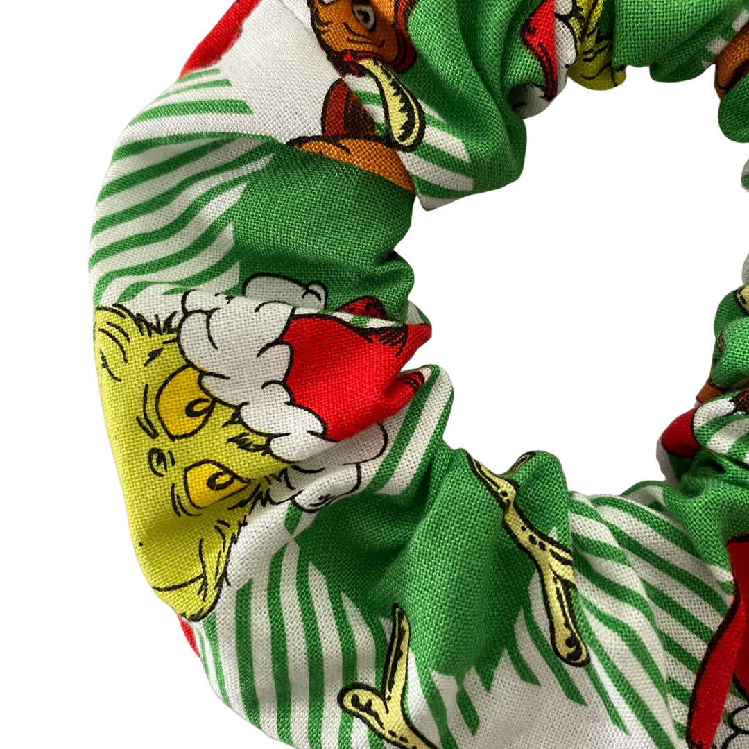 Grinch character pattern scrunchie on a green check fabric.