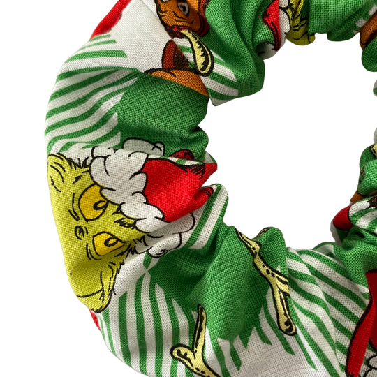 Grinch character pattern scrunchie on a green check fabric.