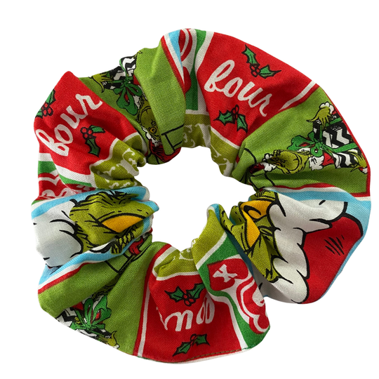 Colourful red and green scrunchie with images of the Grinch.