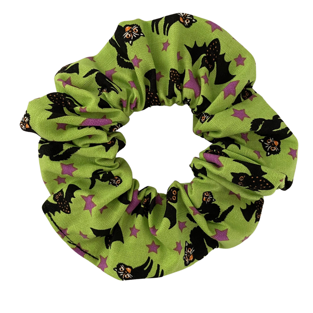 Halloween Scrunchie featuring black cats and black bats on green soft cotton woven fabric.