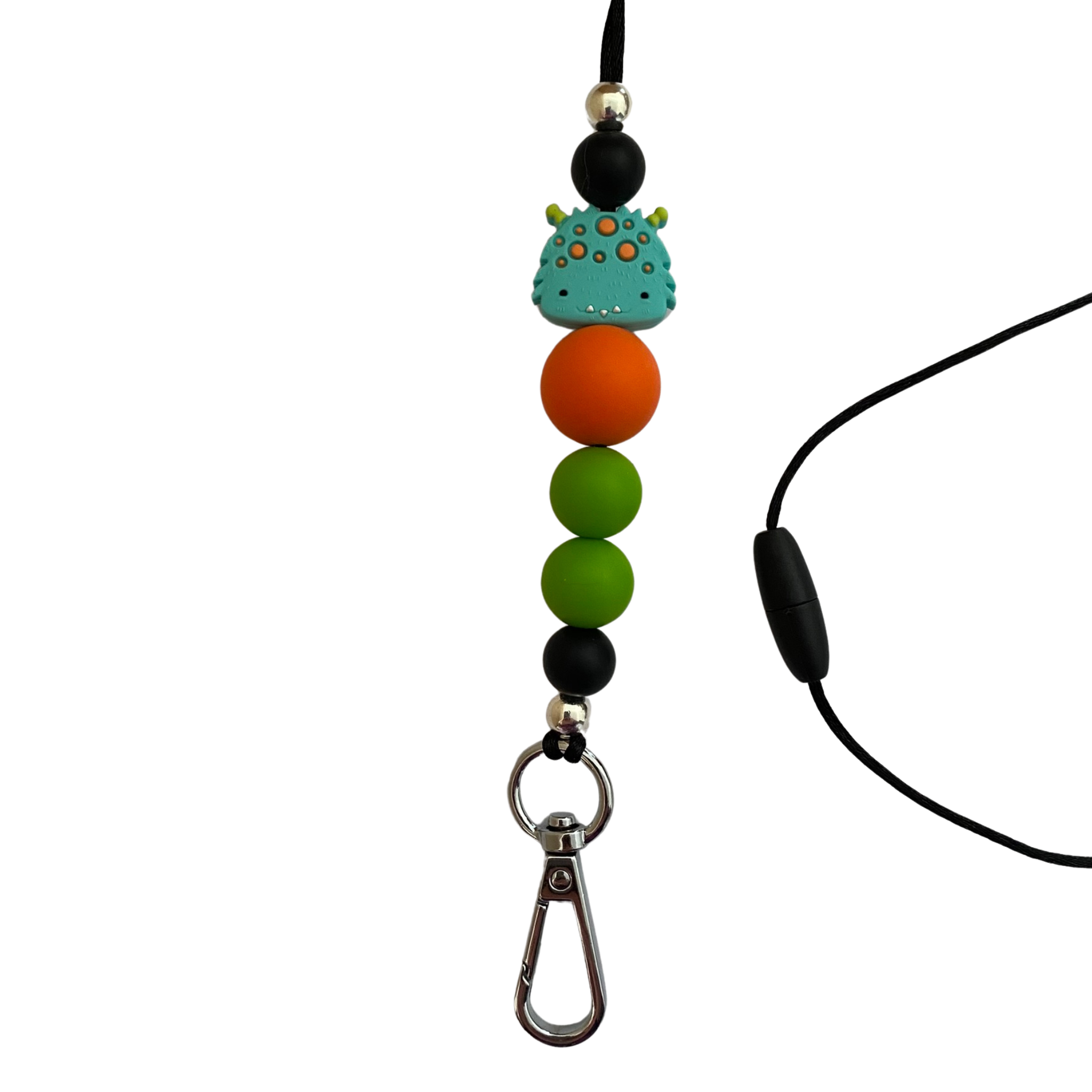 A 60cm lanyard fitted with a safety break away clasp and a happy monster silicone bead and other coloured round silicone beads.
