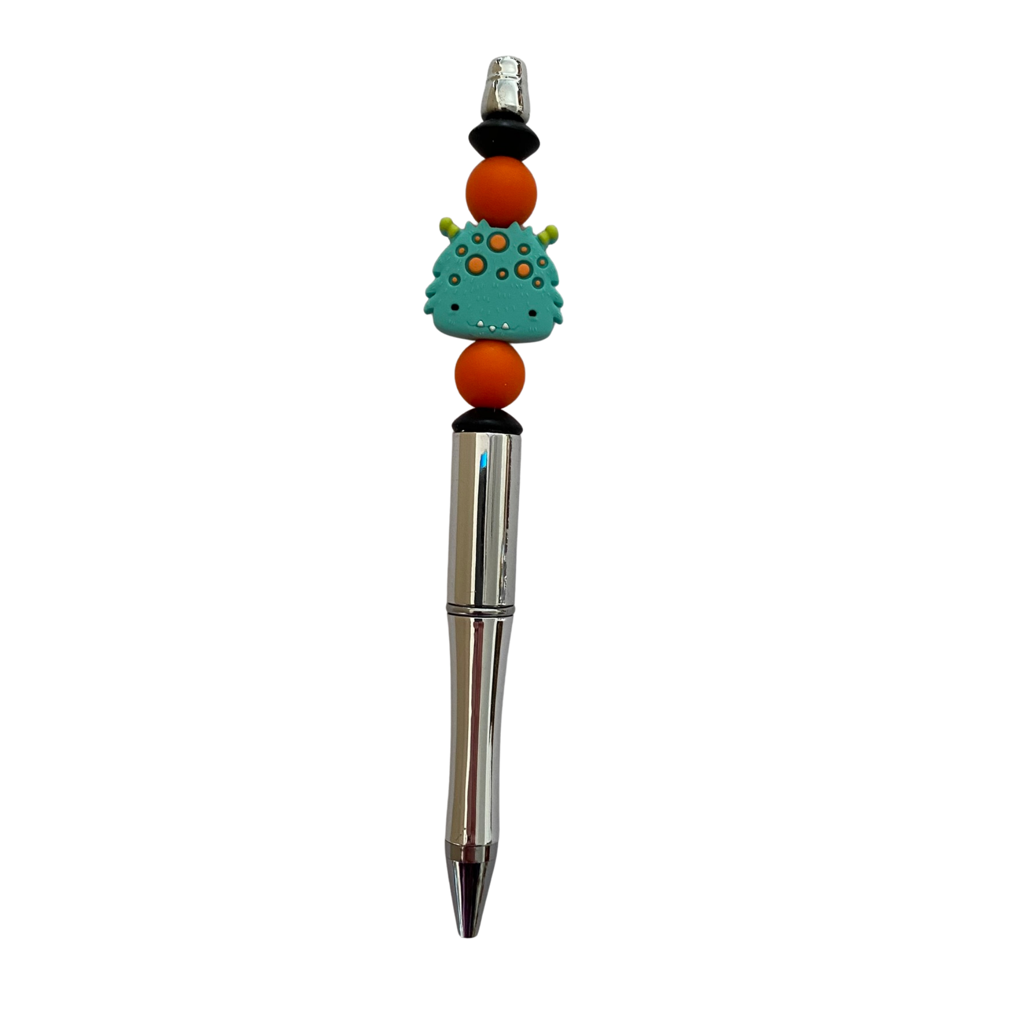 Pen with a happy monster silicone bead on top on a white background.
