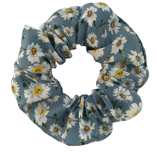 A soft rayon scrunchie with white daisies on a rich blue fabric.
