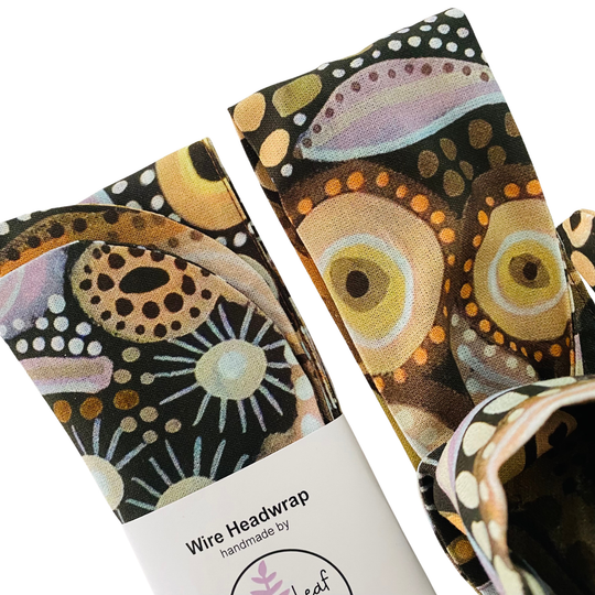 Close up view of Medicine Country Wire Headwrap with Aboriginal artwork by Holly Sanders. Handmade cotton headwrap inspired by traditional bush medicine and healing plants.